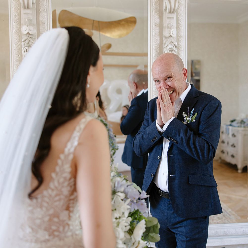 Father of the bride reaction with navy blue suit