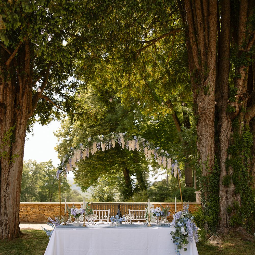Sweetheart wedding tablescape with blue flowers