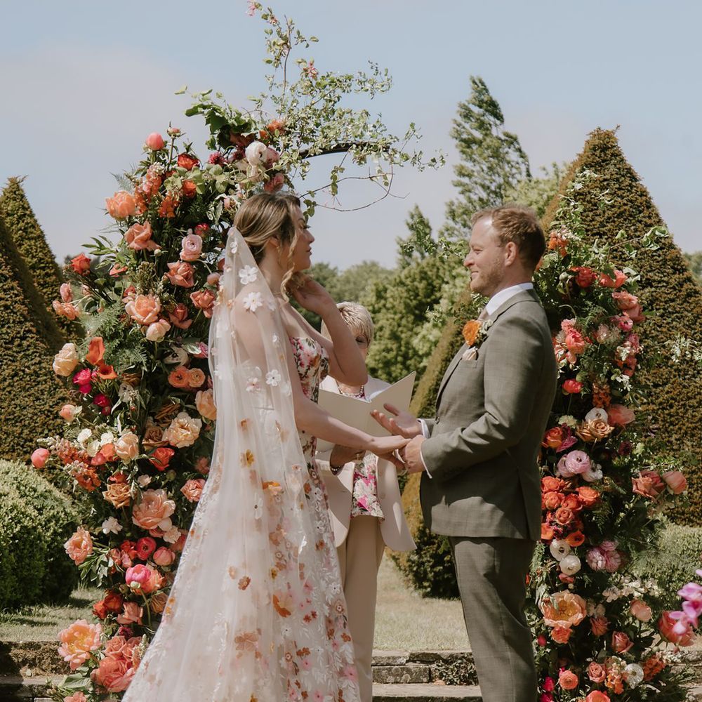 Spring wedding dress with pink floral embroidery 