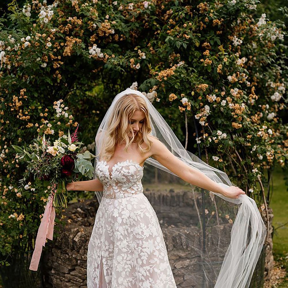 Strapless Lillian West floral spring wedding dress