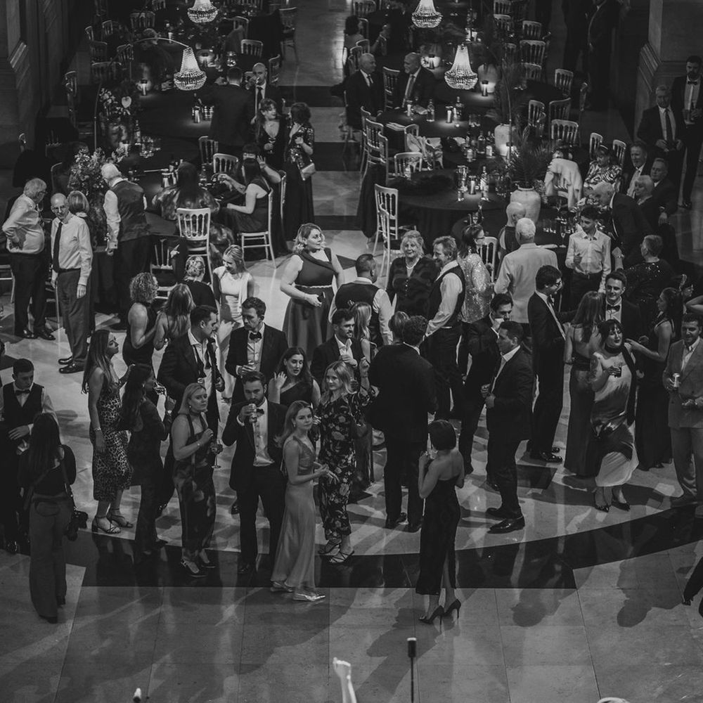 Band performs on stage at wedding reception 