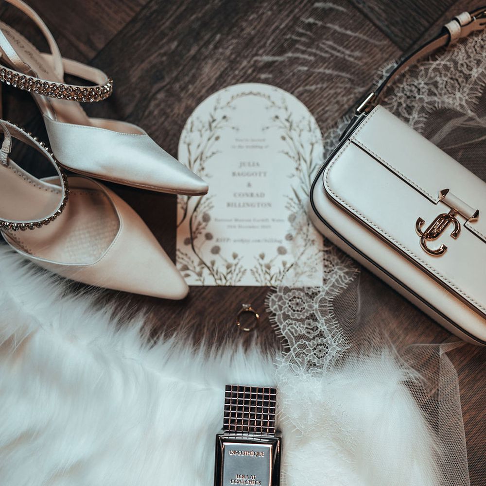 Bridal accessories flat lay with bag and shoes