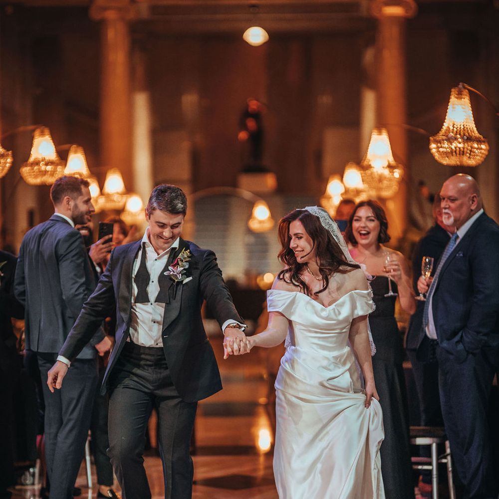 Bride and groom begin first dance 