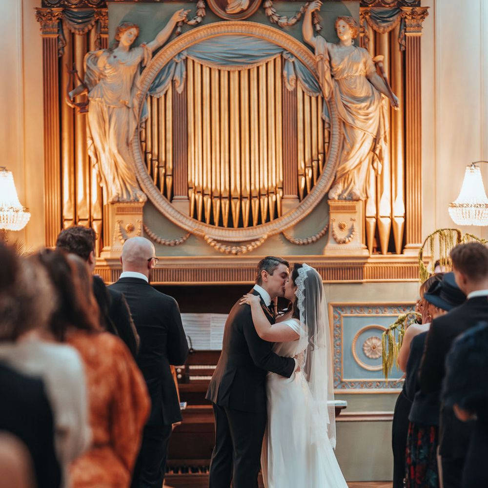 Bride and groom share their first kiss as a married couple