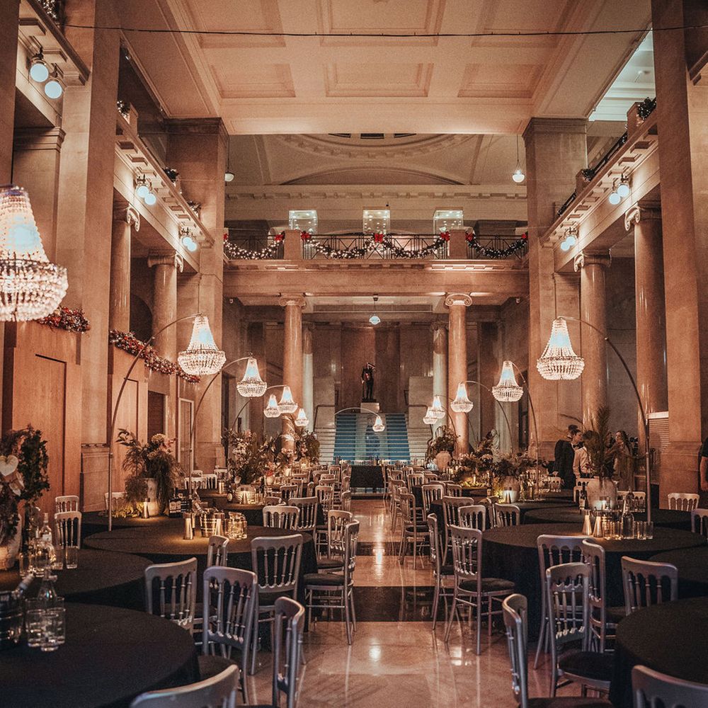Chandeliers hanging above tables at museum