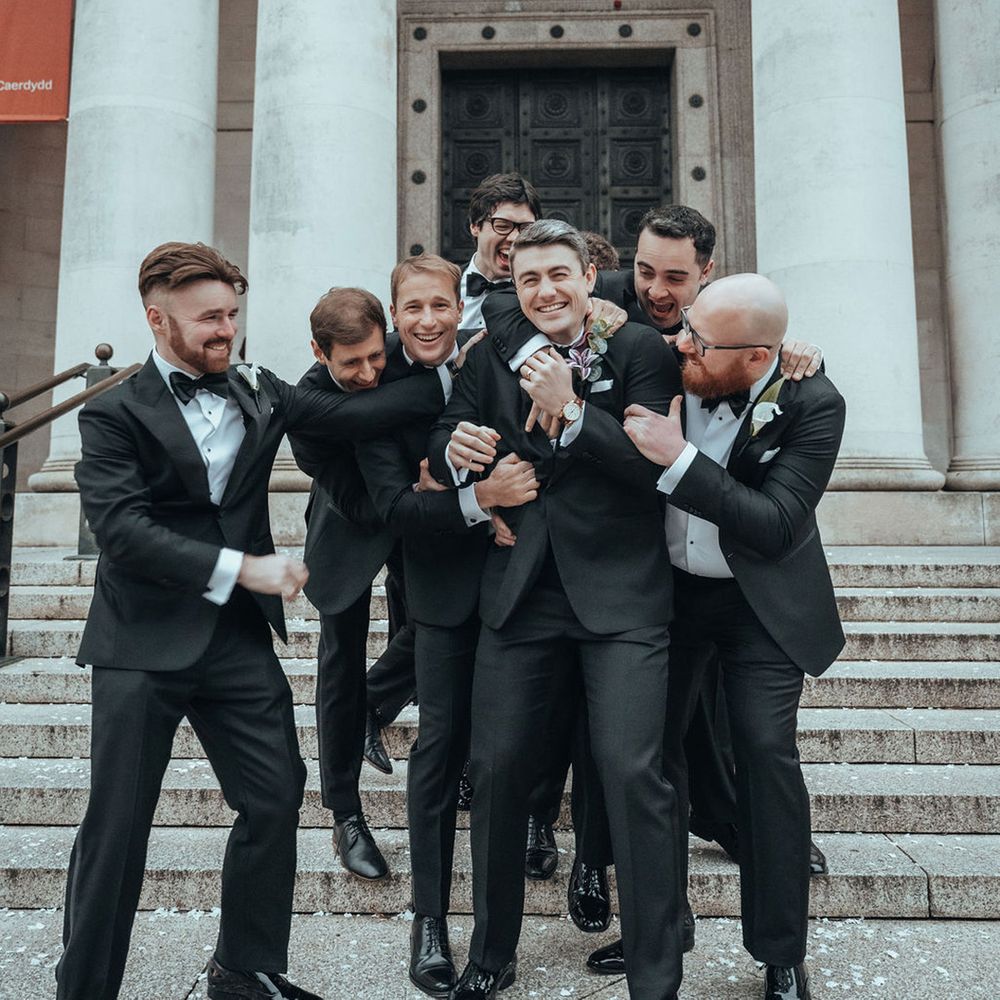 Groomsmen in black tuxedos 