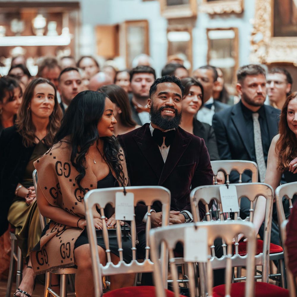 Wedding guests seated for wedding ceremony 