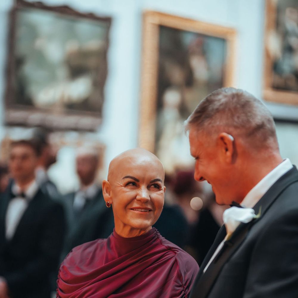 Wedding guests smiling in the gallery ceremony room