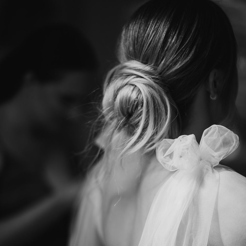 Elegant bridal updo with loose tendrils
