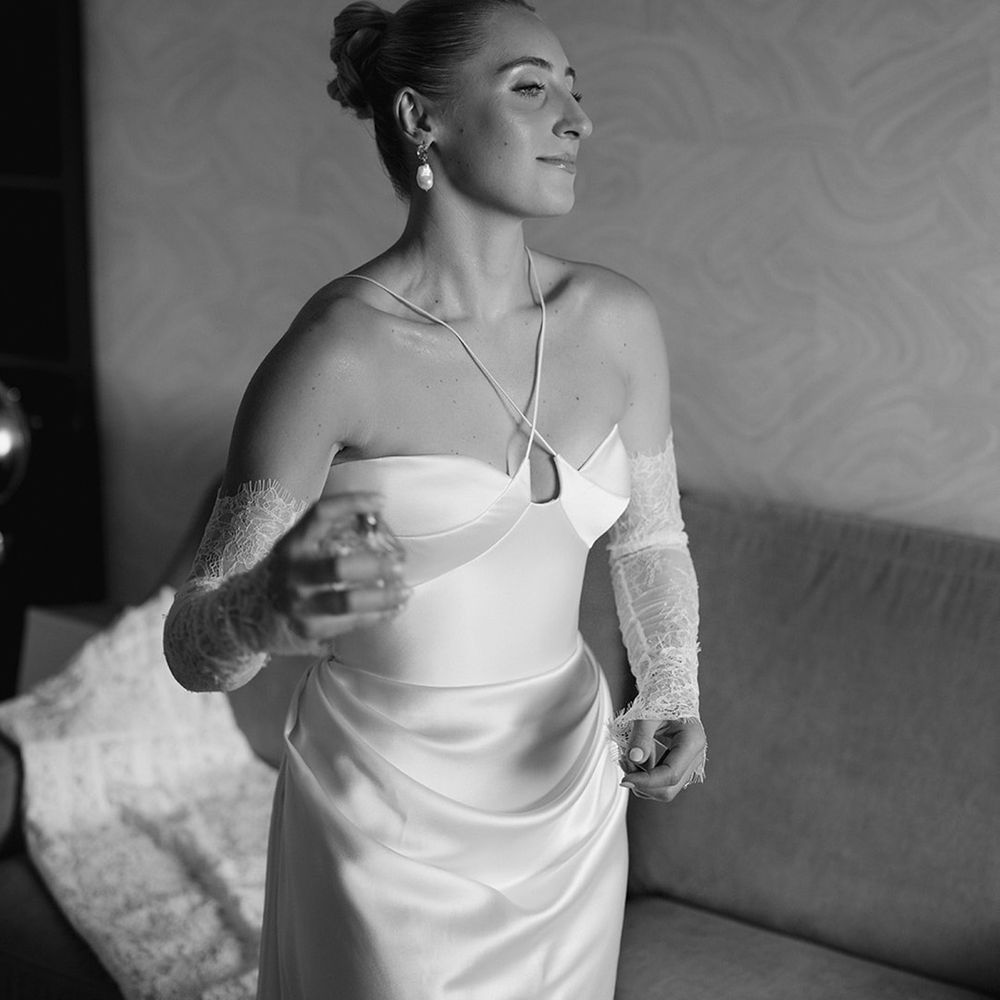 Bride sprays perfume as she gets ready for wedding 