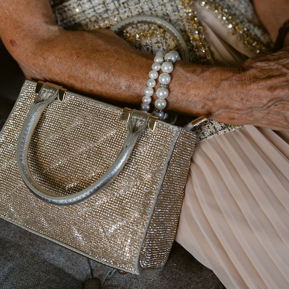 Grandmother wears stylish accessories and bag 