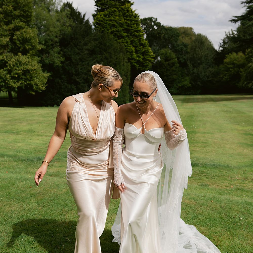 Maid of honour with bride on wedding day 
