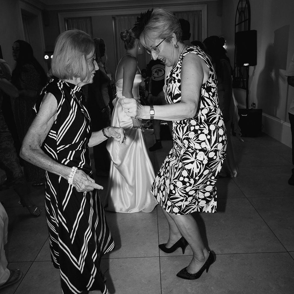 Wedding guests dancing at the reception 