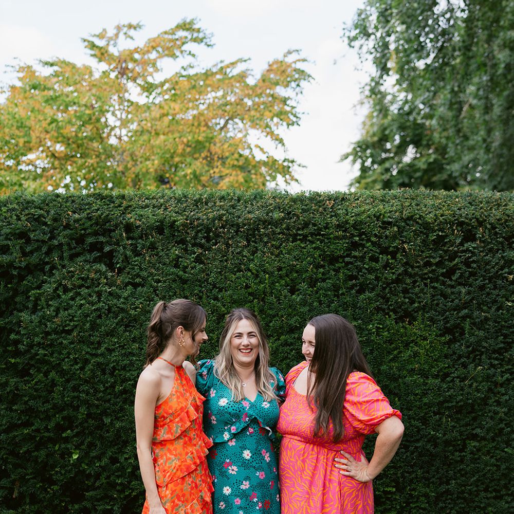 Wedding guests in colourful patterned dresses