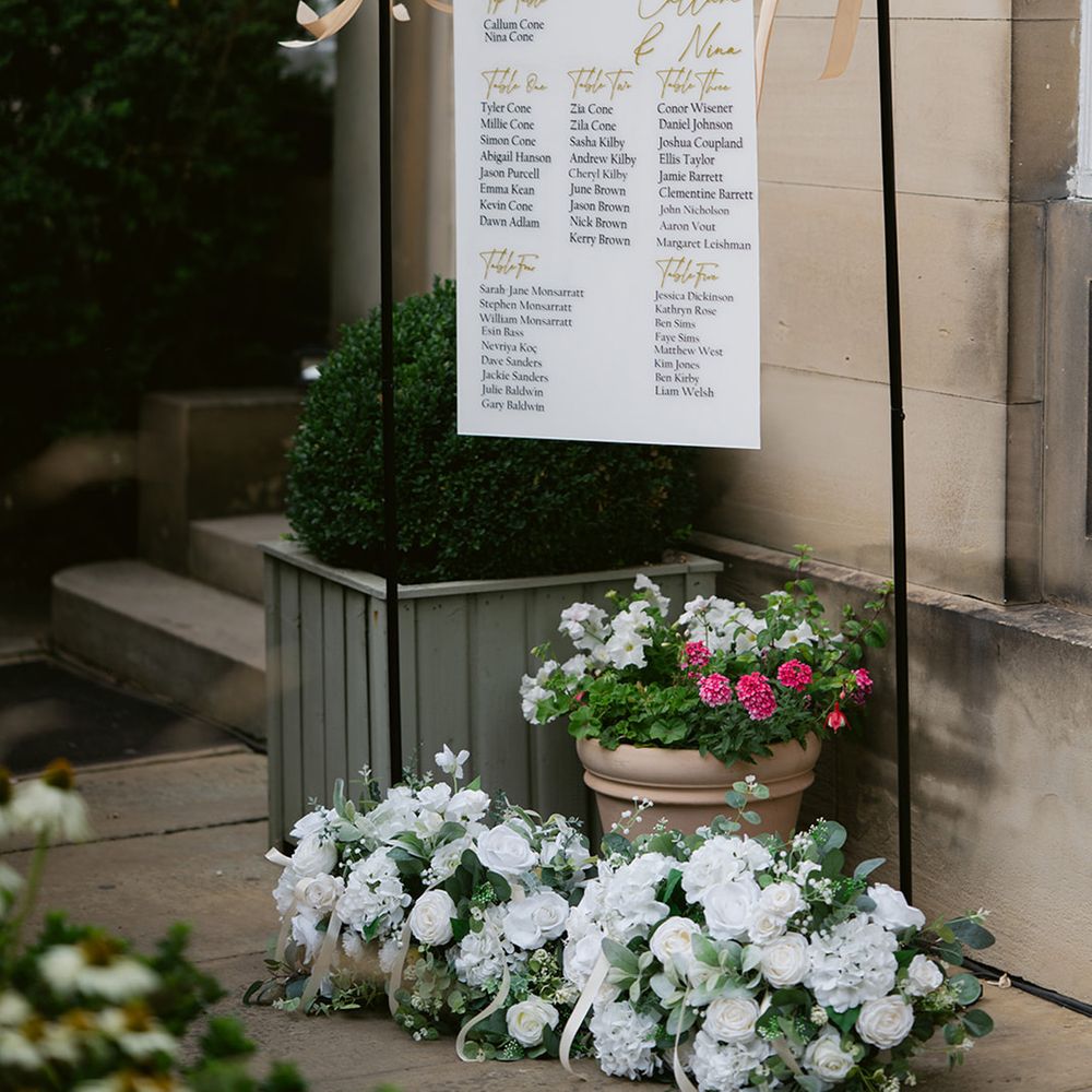 Wedding seating chart signage with satin bow ribbons