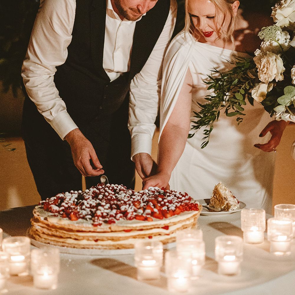 Bride and groom cut their wedding cake 