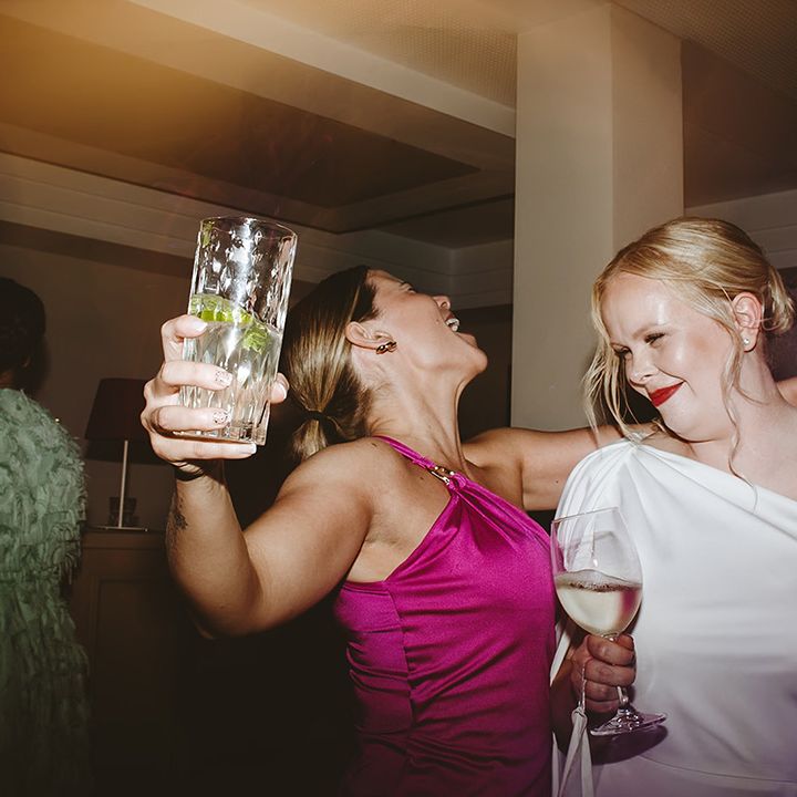 Wedding reception bride dances with guest