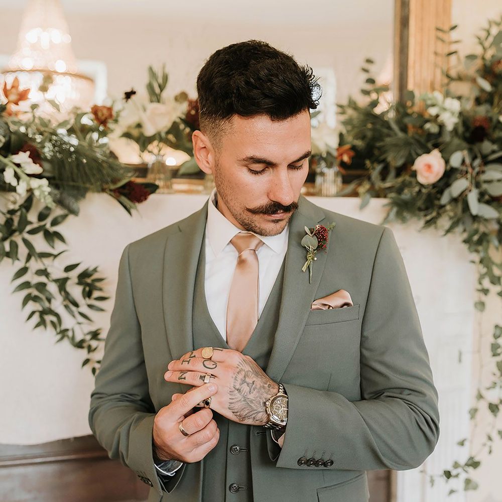 Groom wearing pink wedding tie with matching pocket square