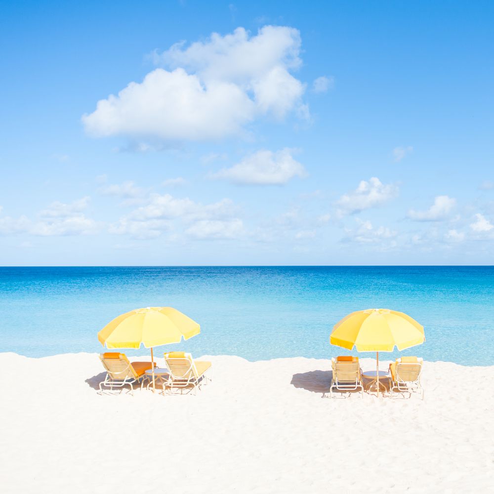Yellow umbrellas over sun loungers 