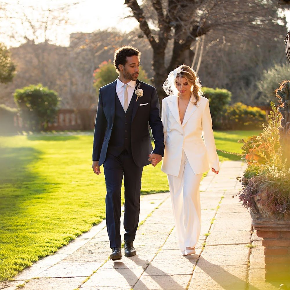 Couple wearing Hockerty and Sumissura custom wedding suits