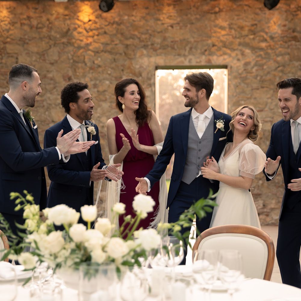 Wedding party wearing Hockerty and Sumissura custom wedding suits and dresses