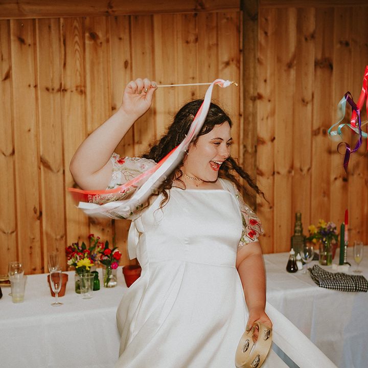 Bride dancing with satin ribbons 