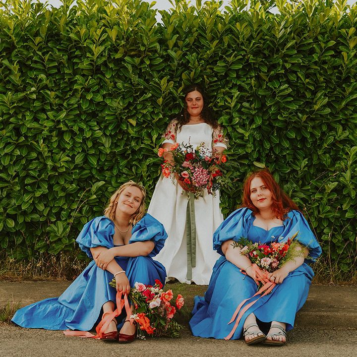 Bridesmaids in blue puff sleeve bridesmaid dresses