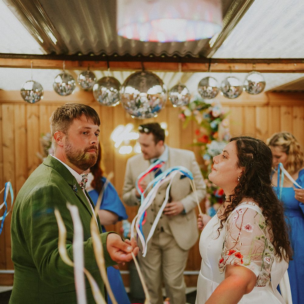 Couple dances with ribbons 