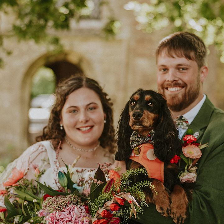 Couple poses with their pet dog 