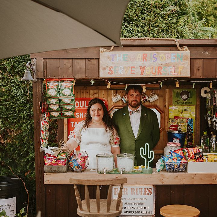 Couple with their DIY outdoor bar 