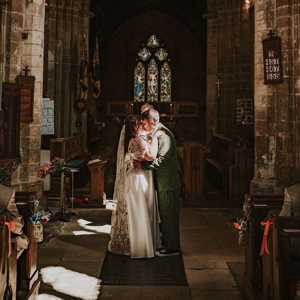 First kiss for couple at church wedding 