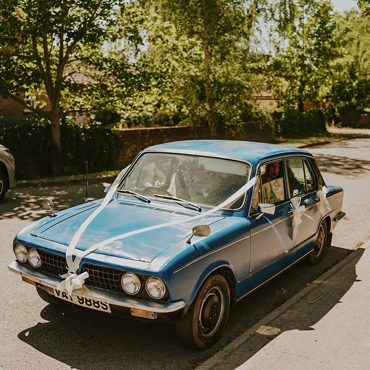 White ribbon wedding car decor 