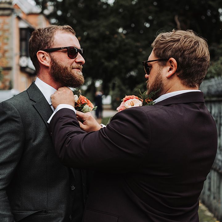 Best man helps the grom get ready