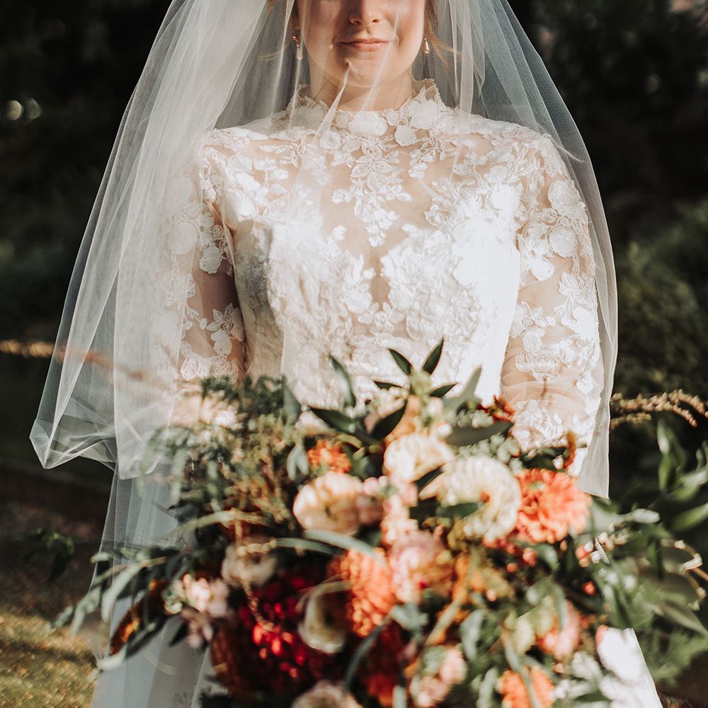Bride in floral lace long sleeve Grace Kelly inspired wedding dress