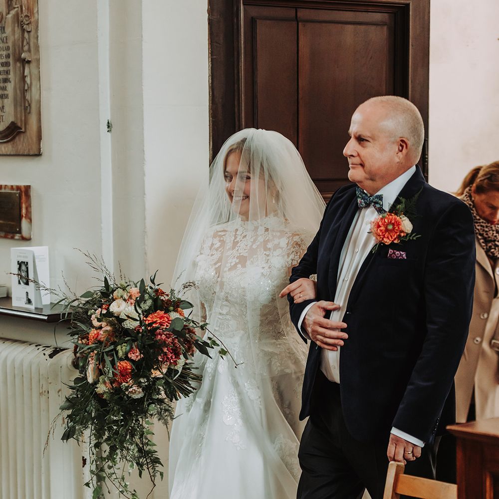 Father of the bride walks bride down the aisle