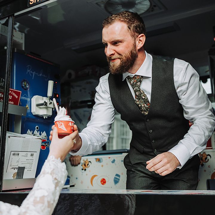 Groom serves ice cream in ice cream van 