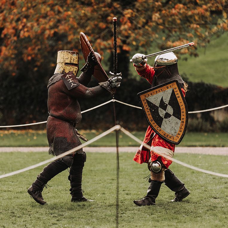 Knights sword fighting at wedding 