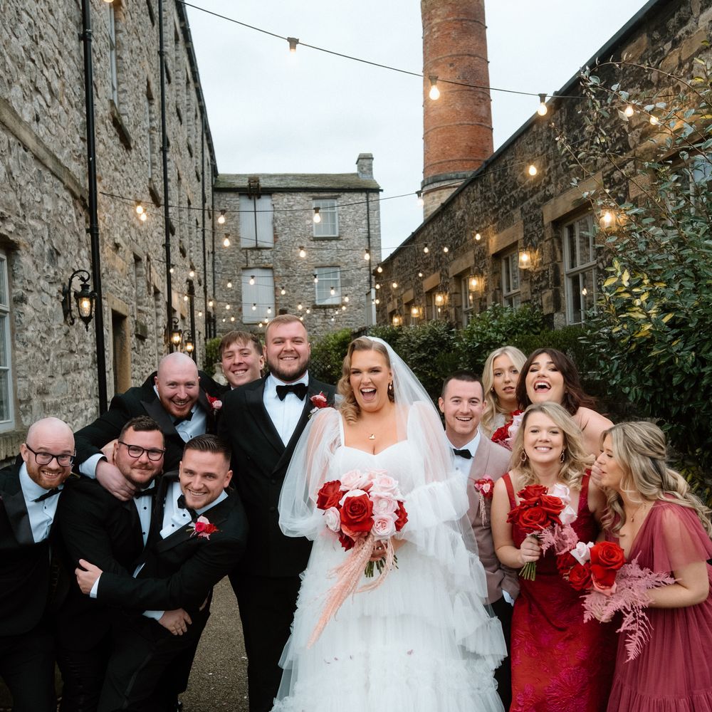 bridal party groomsmen with bride and groom