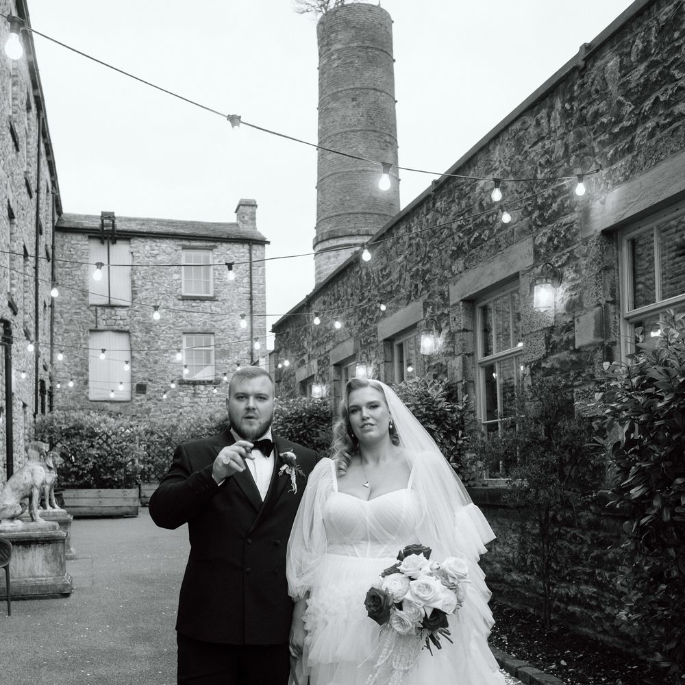 bride and groom with pet bulldog