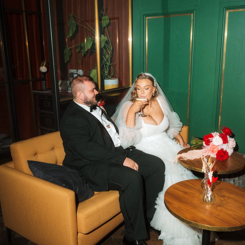 bride and groom sip cocktails