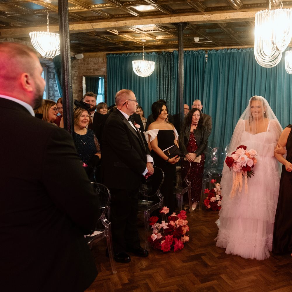bride walking down aisle tulle dress