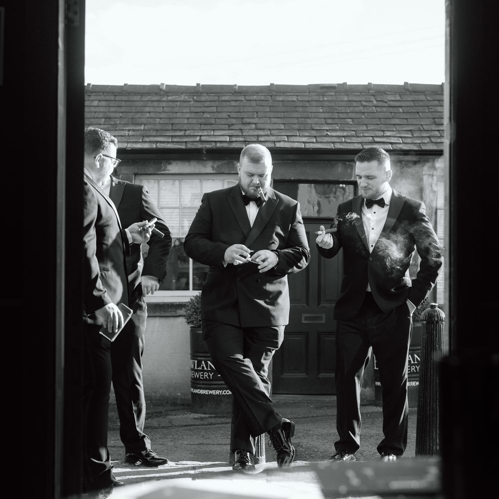 groomsmen smoking cigars