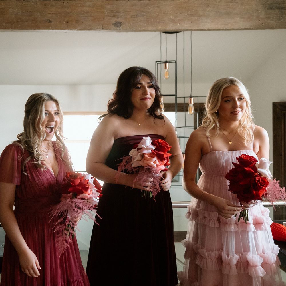 shades of pink red bridesmaid first look