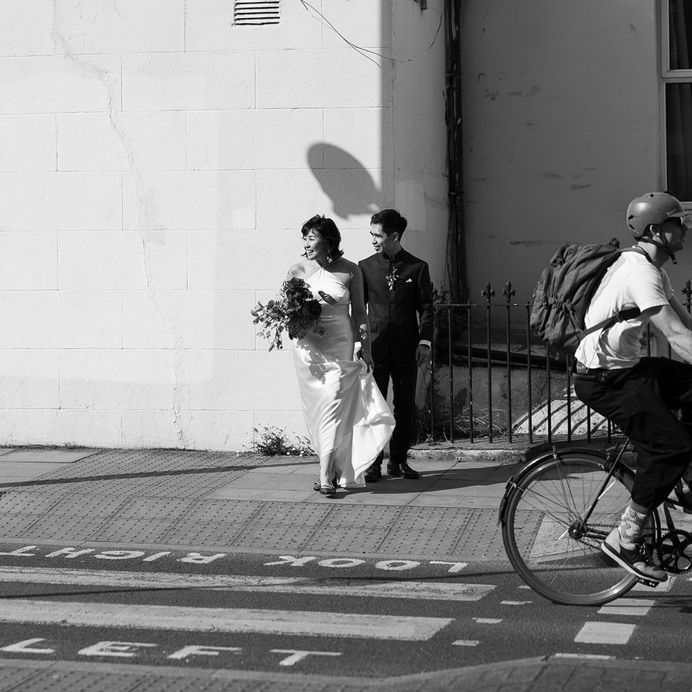 couple crossing london road