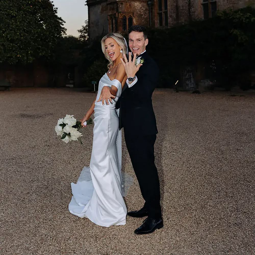 Bride and groom show off something new wedding rings
