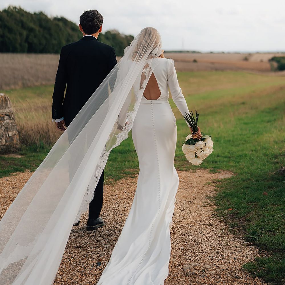 Classic couple traditional wedding portrait, bride wearing something old veil