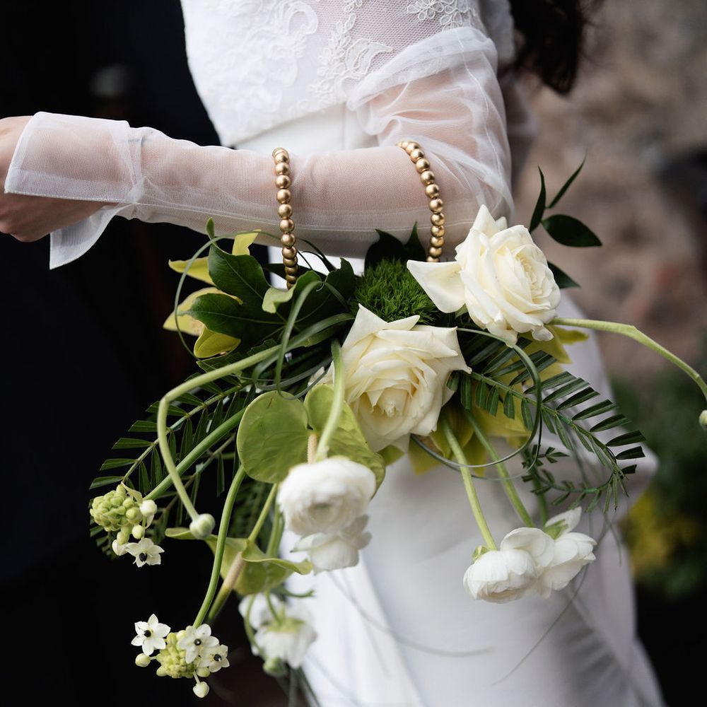 bride bouquet gold handle white flowers