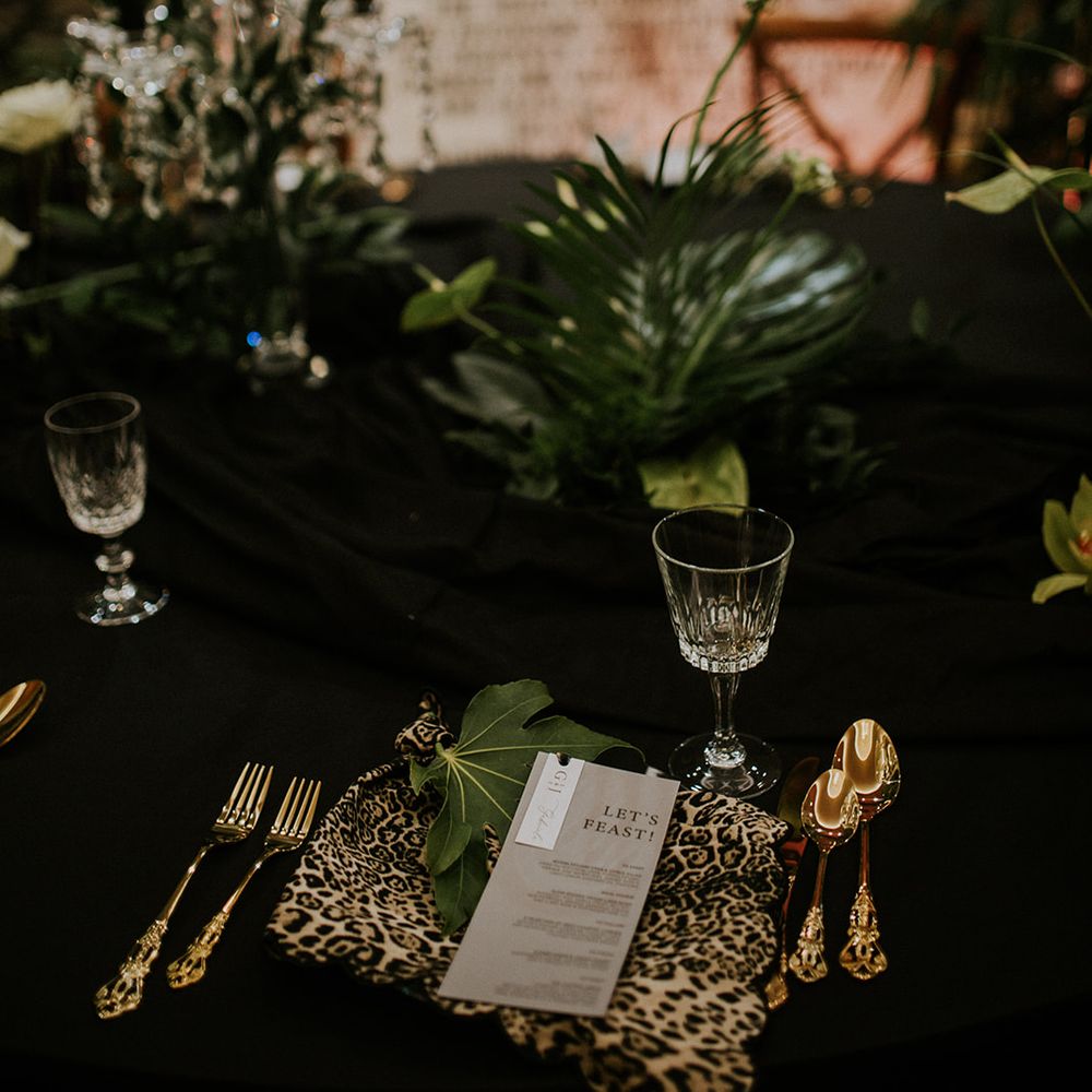 leopard print tablescape crystal wine glasses