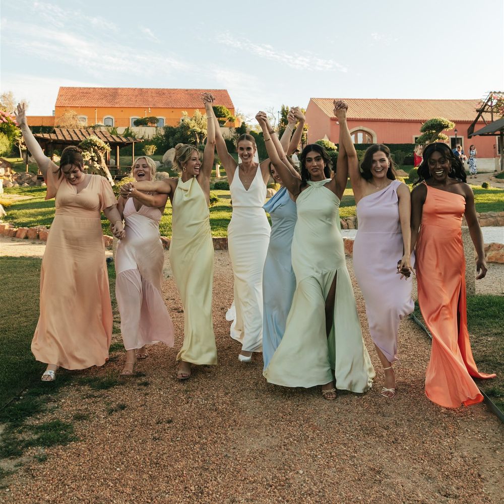 bridesmaids in pastel rainbow dresses