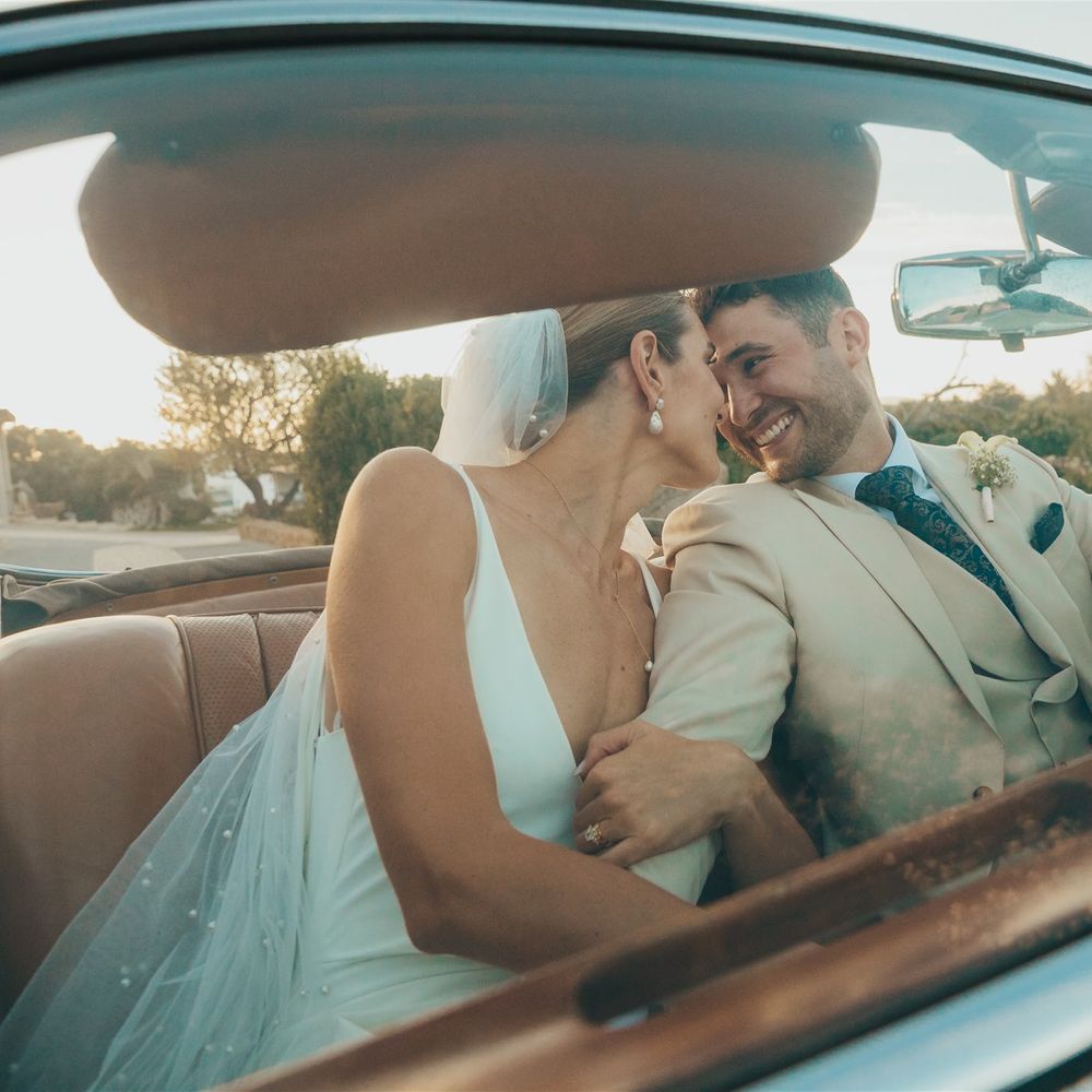 couple kiss in vintage car